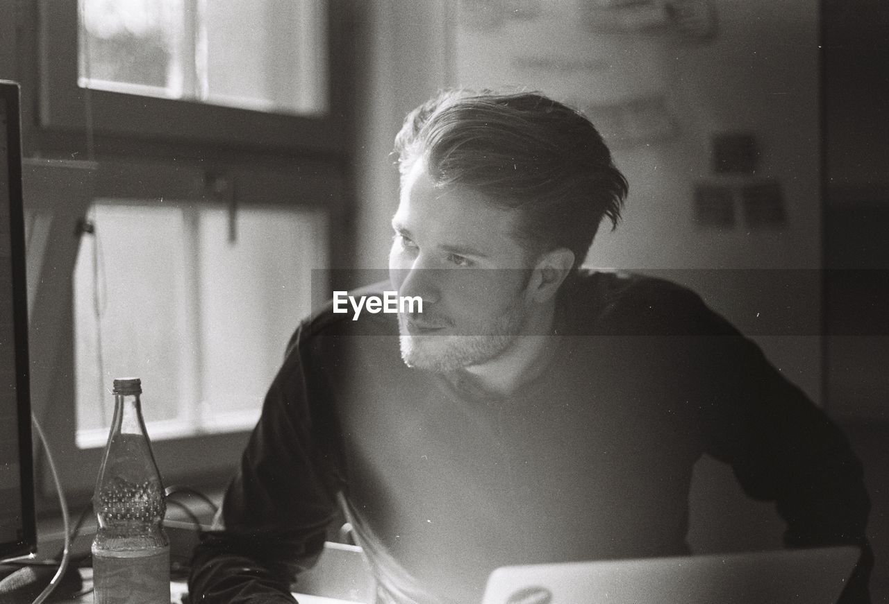 Portrait of young man in office