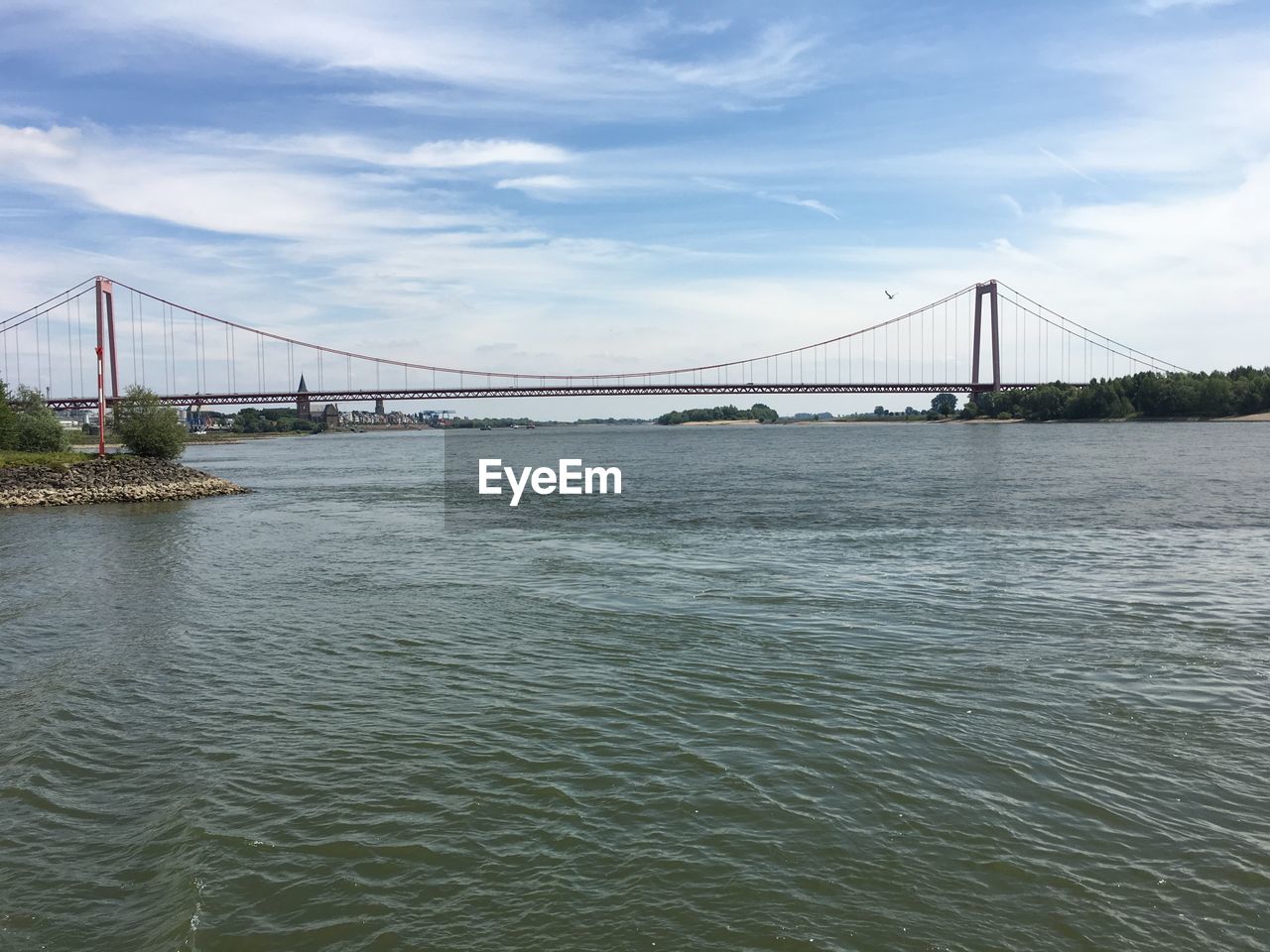VIEW OF SUSPENSION BRIDGE OVER WATER