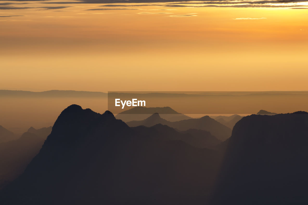 Layer of mountains with misty in morning