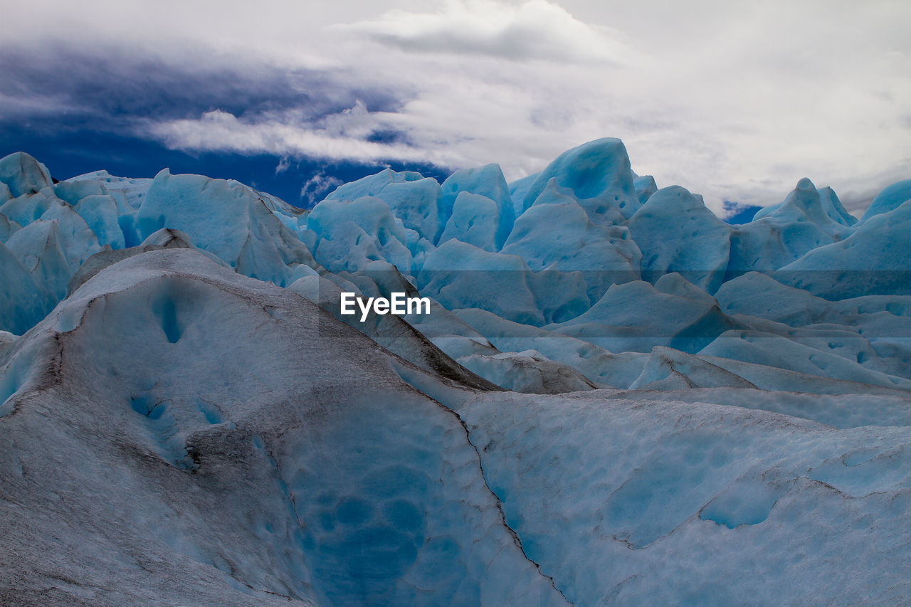 Snow covered landscape against sky