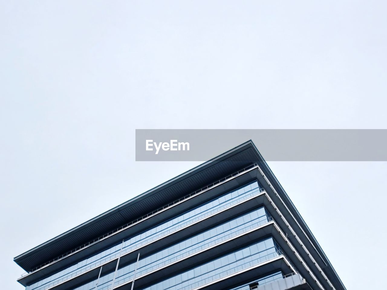 Low angle view of security camera against clear sky