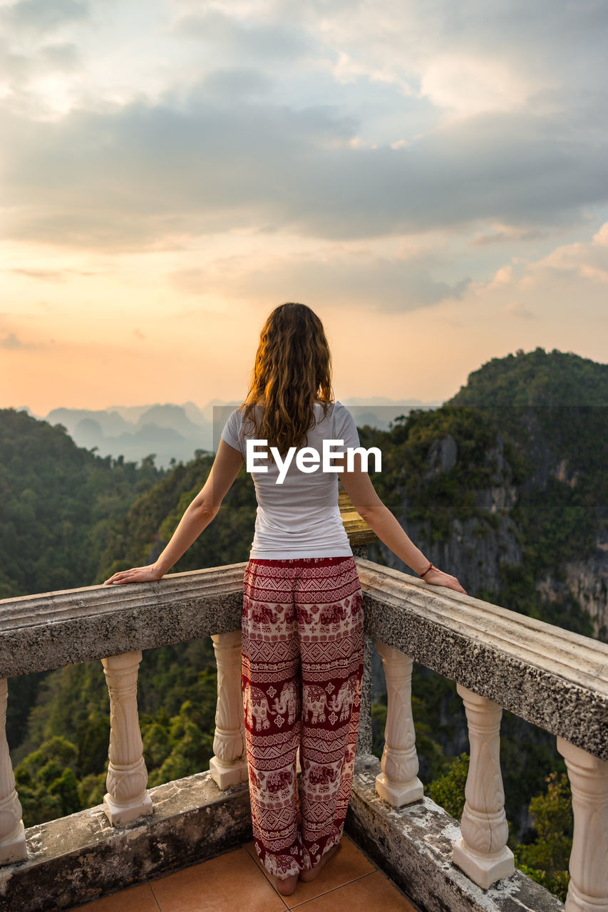 Rear view of woman standing at observation point