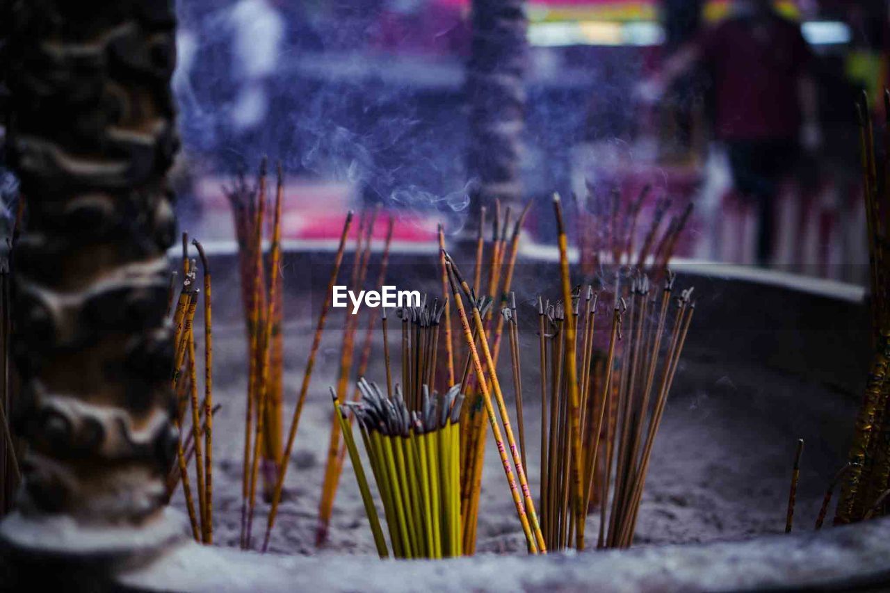 Close-up of incense sticks at temple 