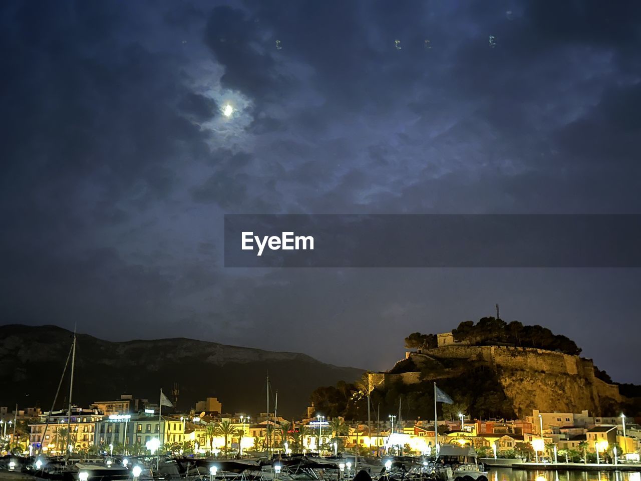 night, sky, illuminated, water, architecture, cloud, nature, building exterior, evening, built structure, mountain, moon, dusk, nautical vessel, building, no people, beauty in nature, travel destinations, sea, city, outdoors, harbor, reflection, scenics - nature, transportation, beach, land, ship, travel, star, cityscape