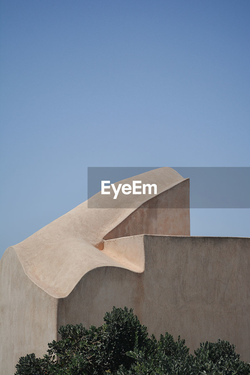 Low angle view of building against blue sky