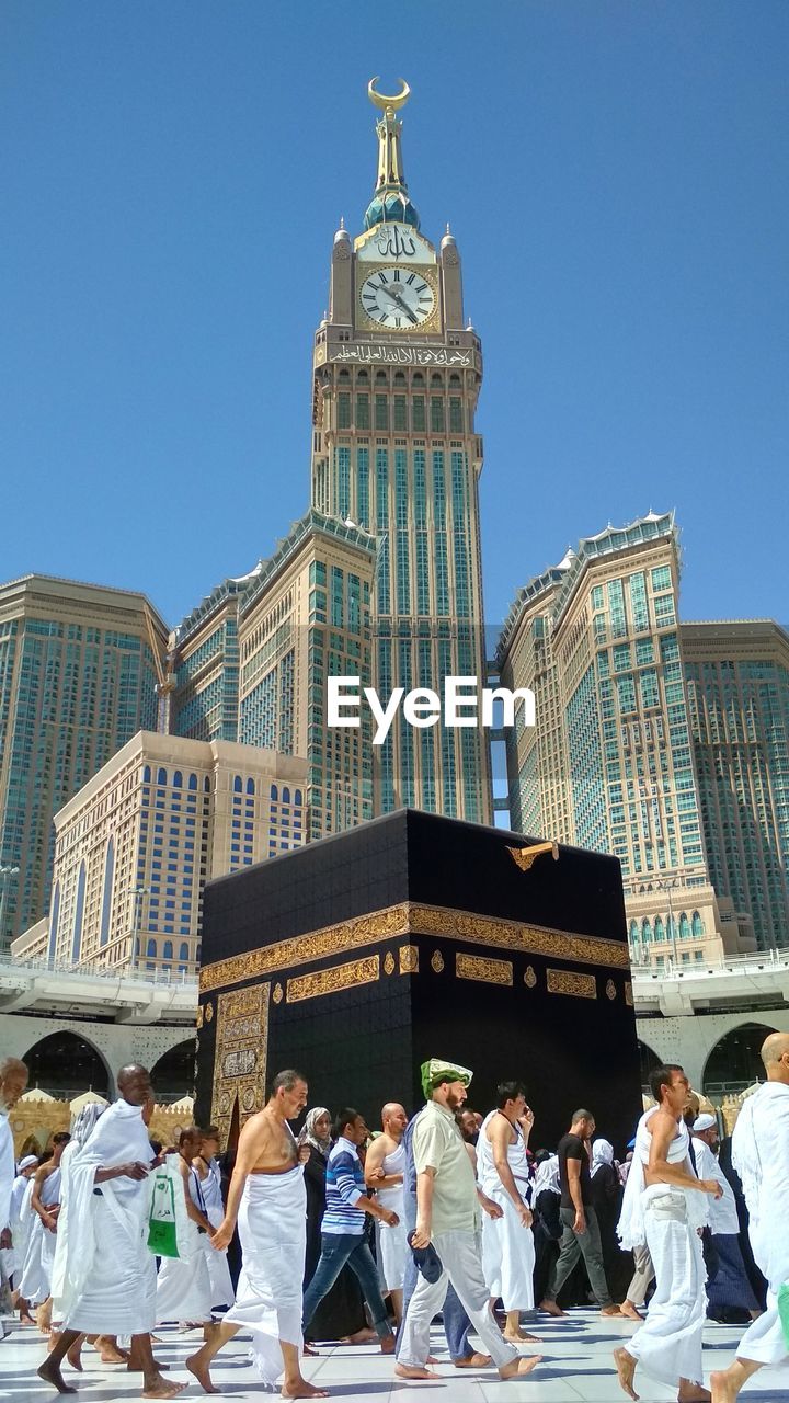 Low angle view of people at mosque