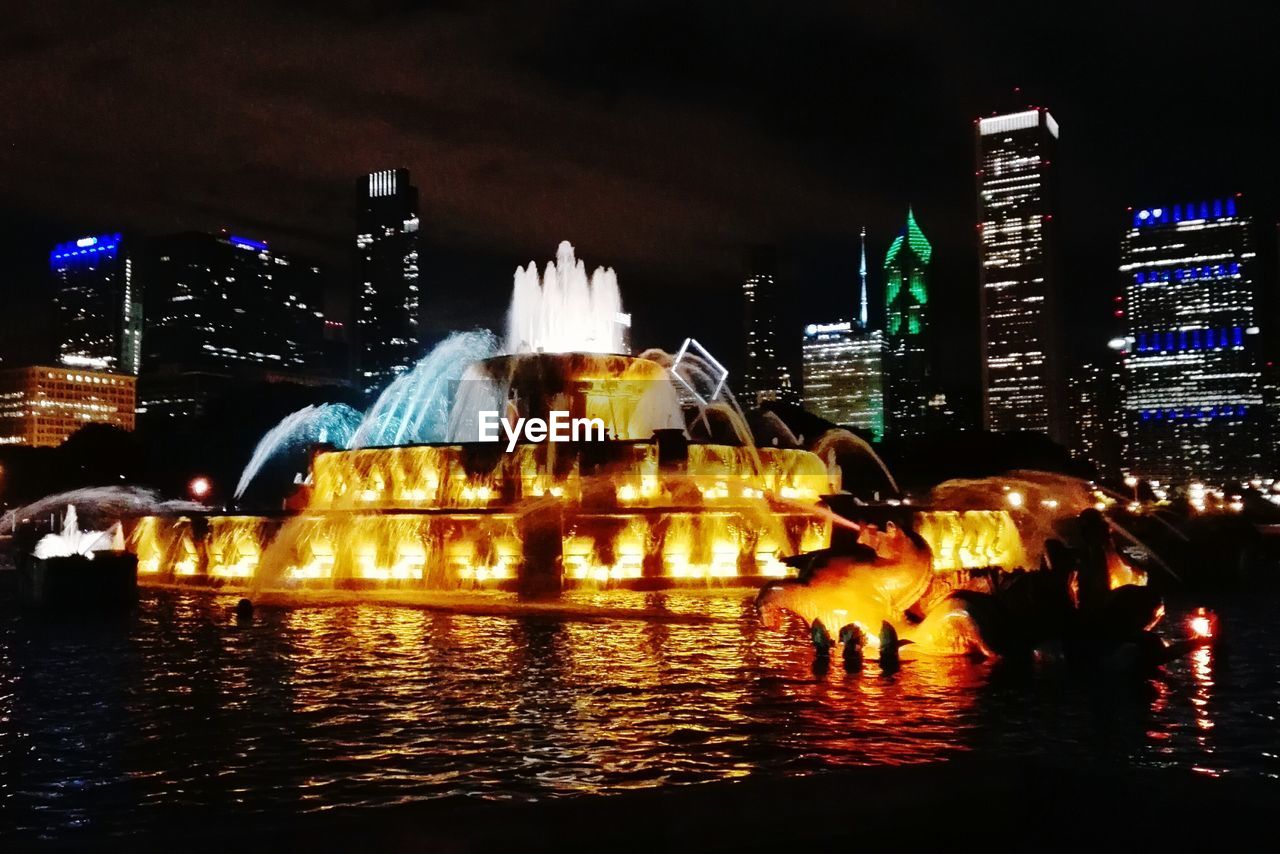 ILLUMINATED FOUNTAIN AT NIGHT