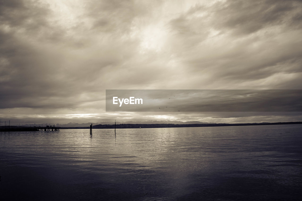 Scenic view of seascape against cloudy sky