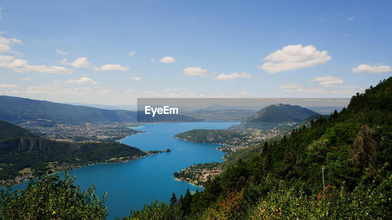 Scenic view of lake surrounded by hills