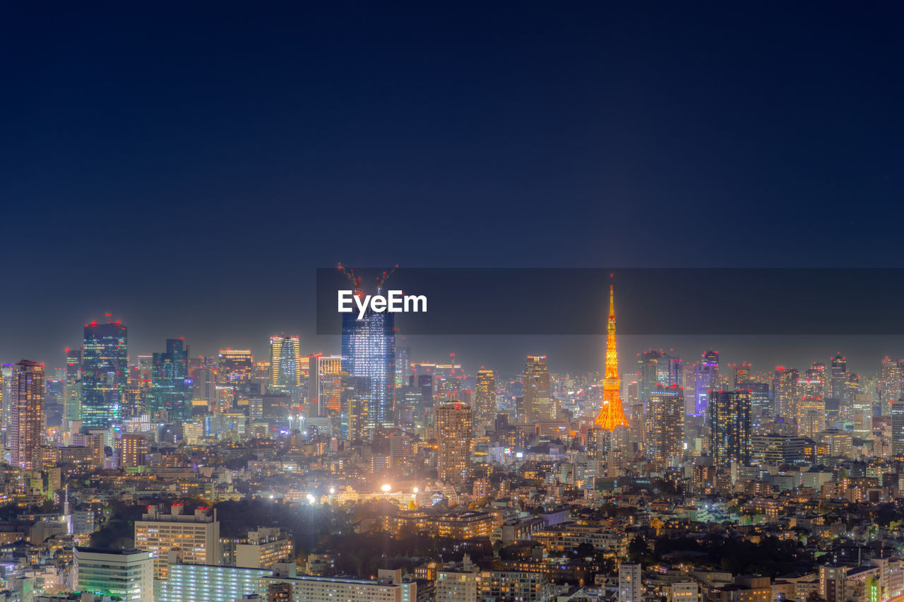 Illuminated buildings in city at night