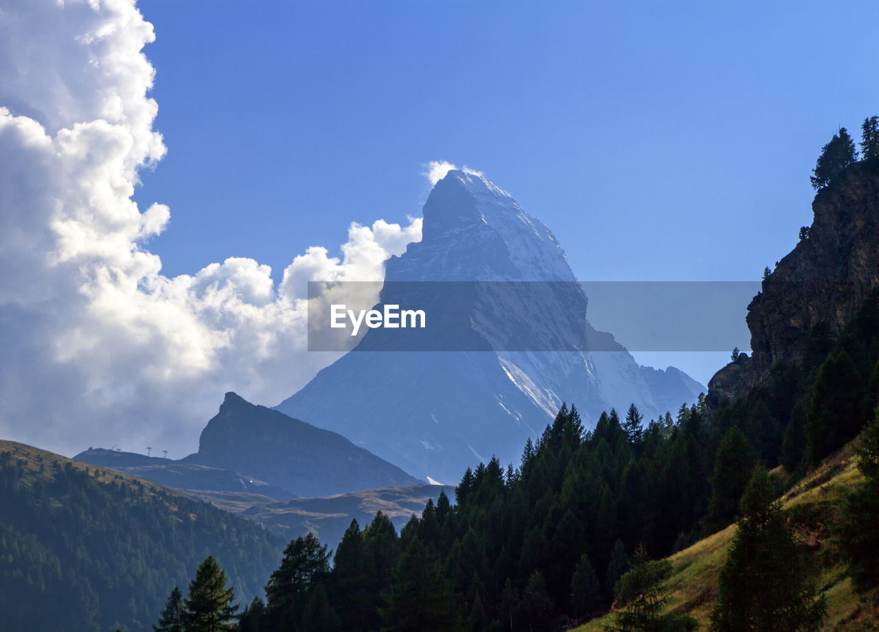 Matterhorn surrounded with clouds by day, zermatt, switzerland
