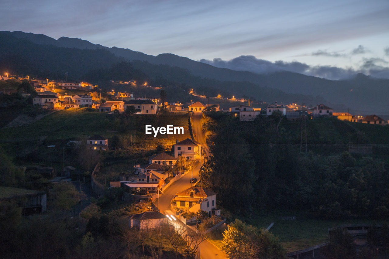 High angle view of illuminated buildings in city at night