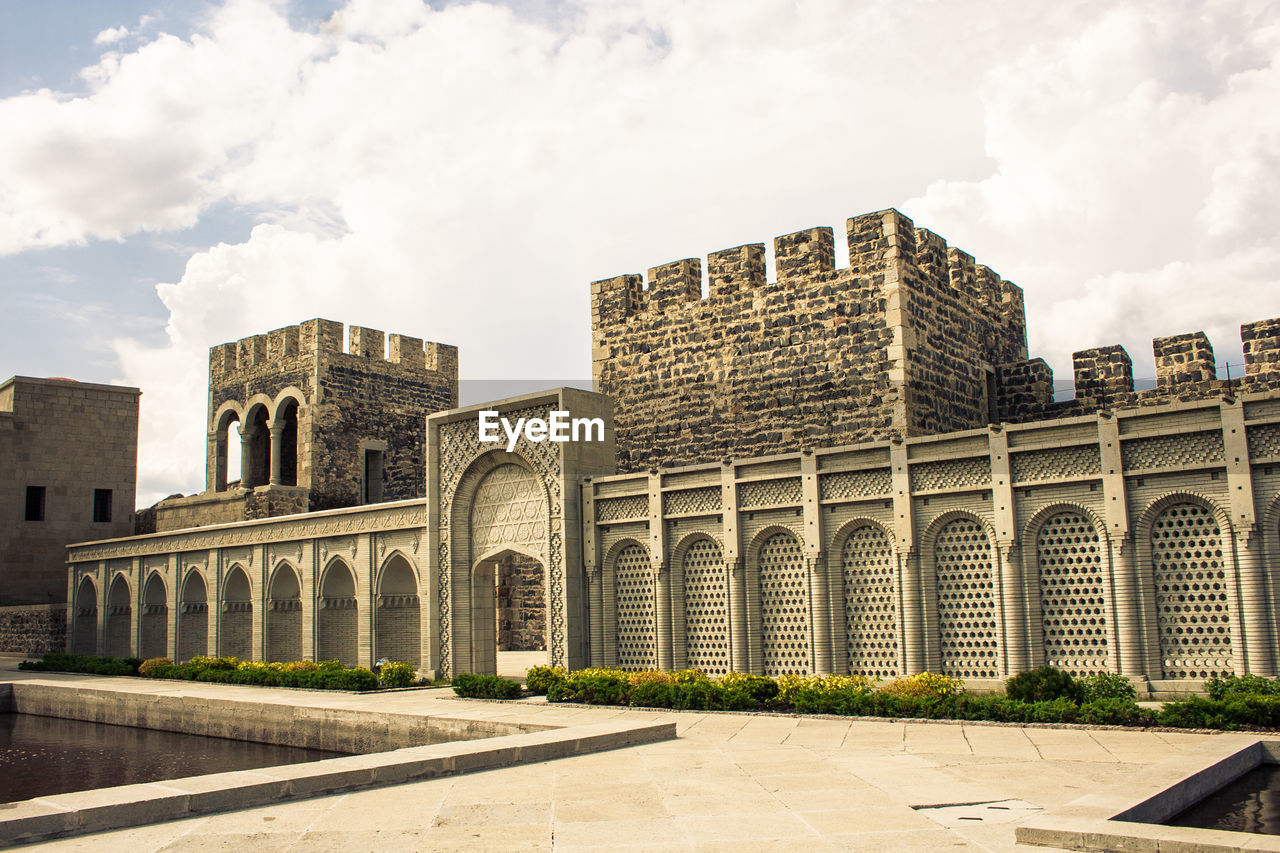 Fortress against cloudy sky