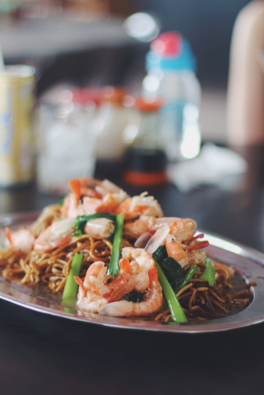 Close-up of fresh seafood served in plate on table at restaurant