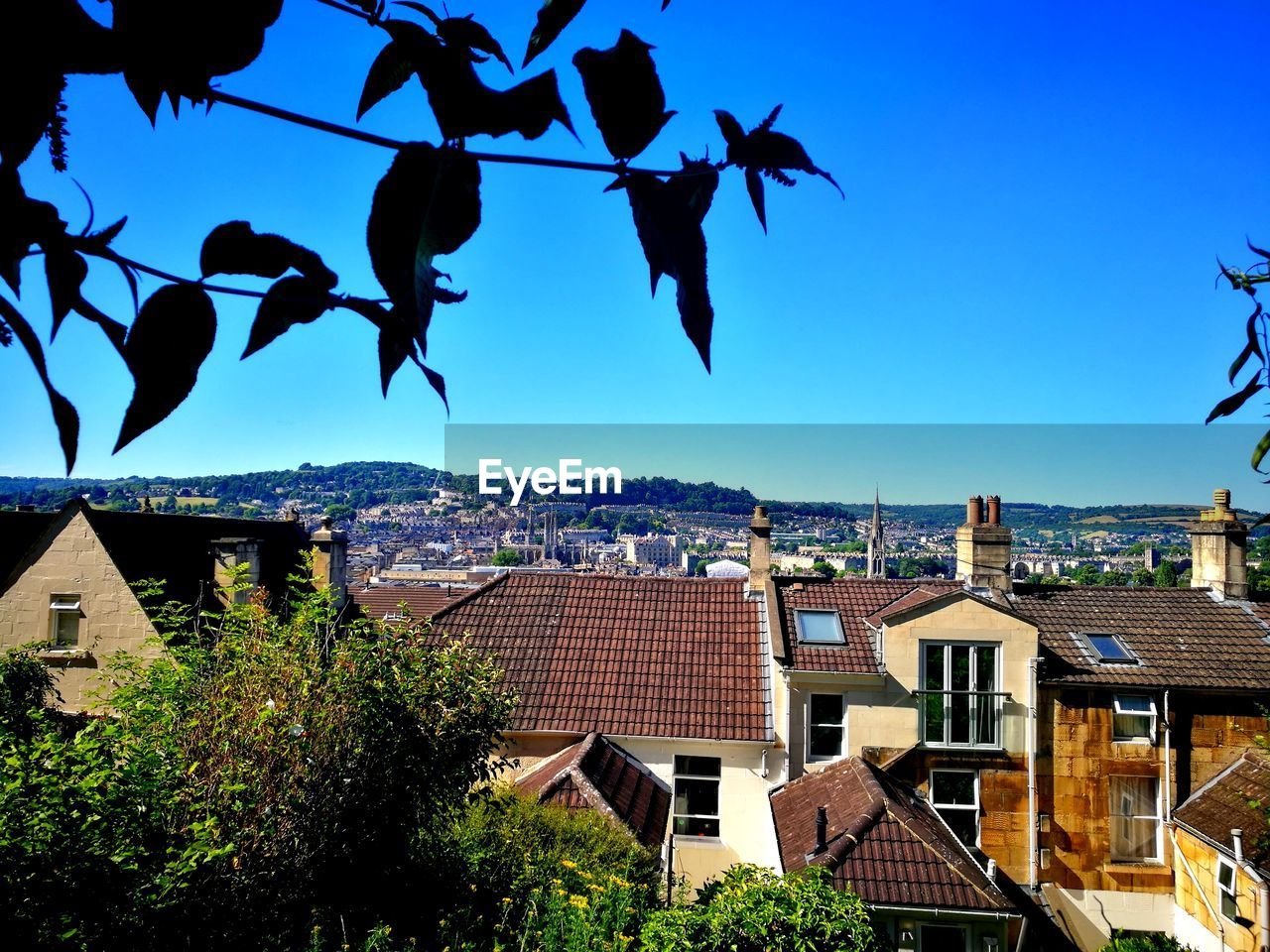 View of townscape against blue sky