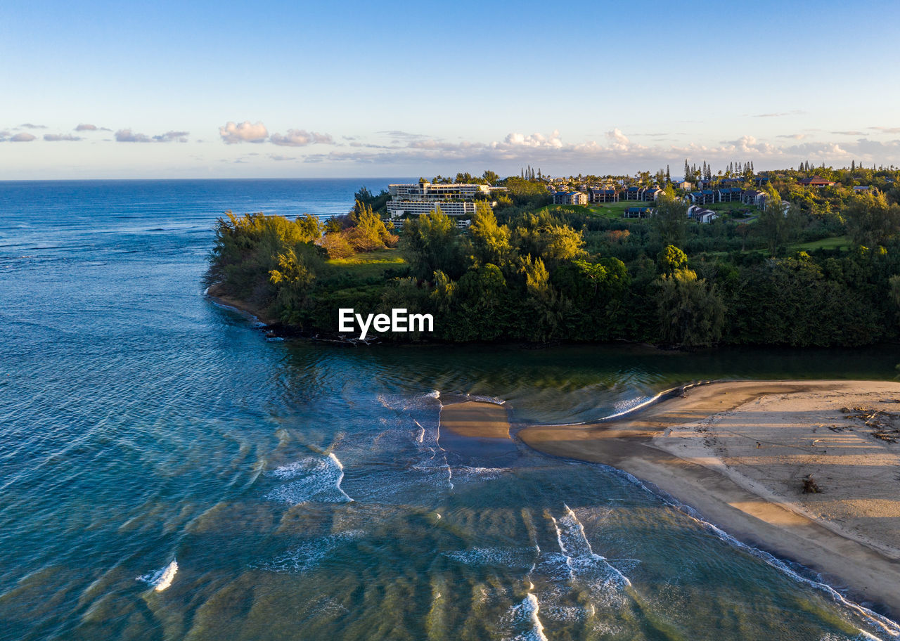 Aerial panoramic image at sunrise off the coast over hanalei bay and princeville on kauai