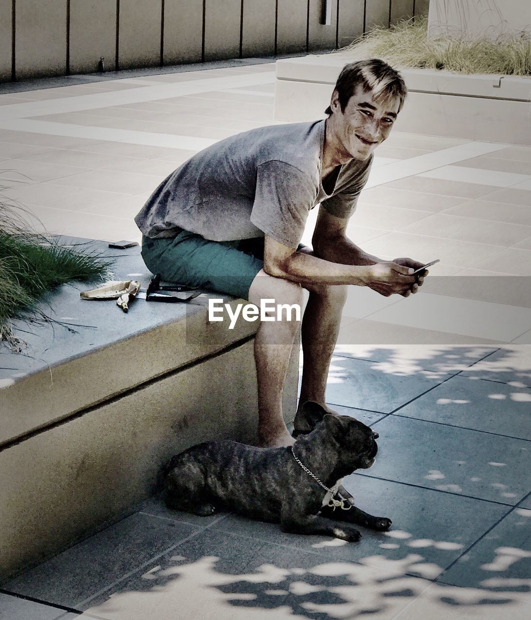 FULL LENGTH OF MAN SITTING ON FLOOR