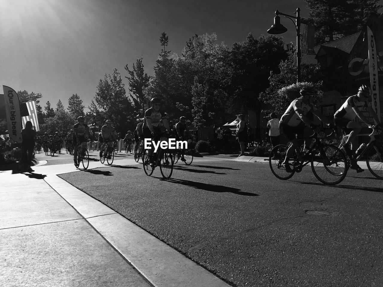 PEOPLE RIDING BICYCLE ON ROAD