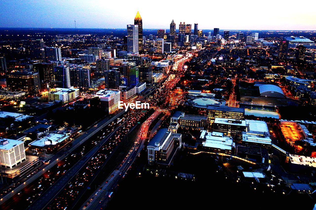 HIGH ANGLE VIEW OF ILLUMINATED CITYSCAPE