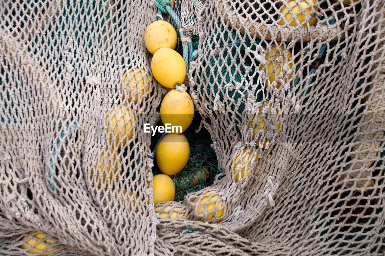 HIGH ANGLE VIEW OF FRUITS IN BASKET ON WOODEN SURFACE