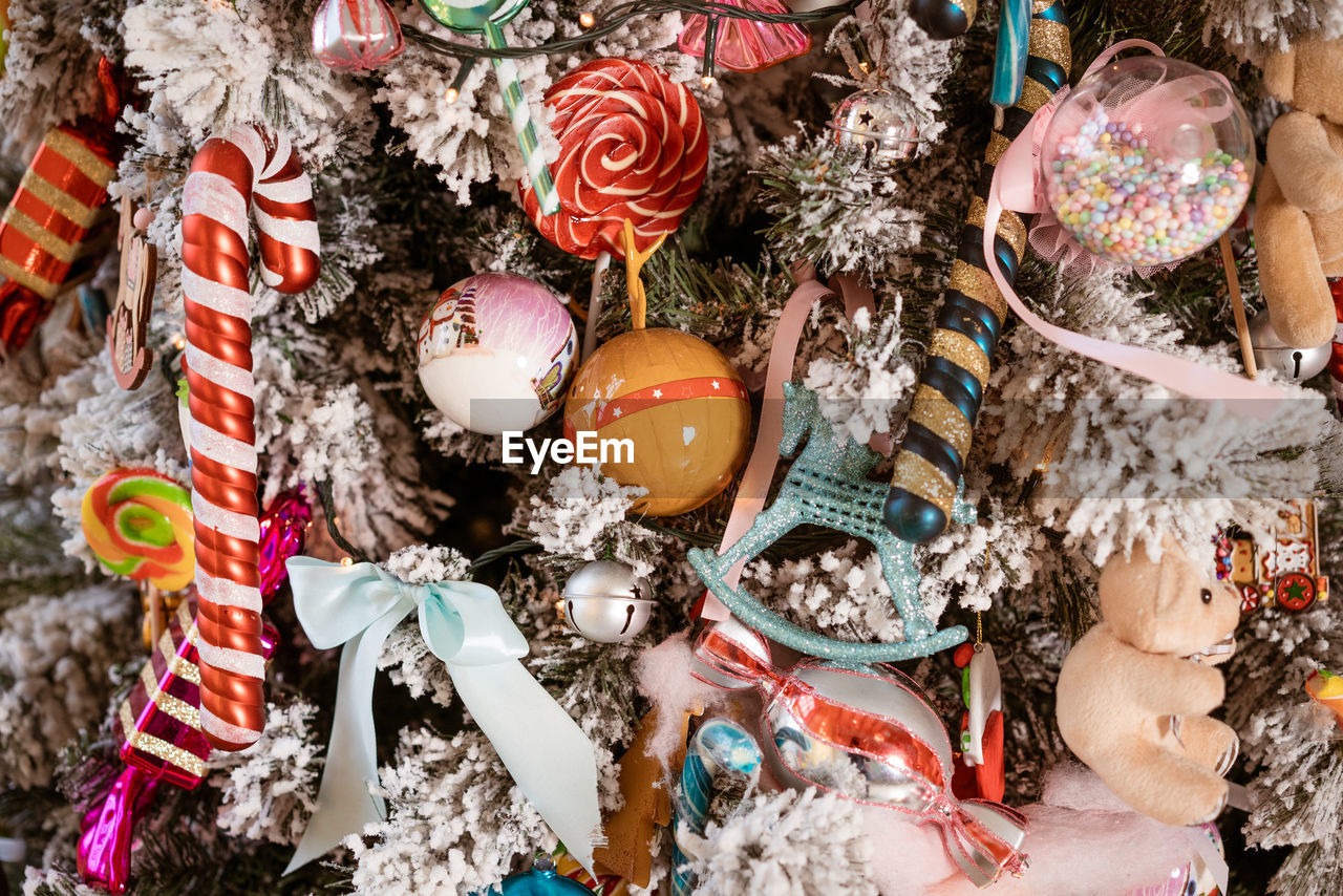 A fragment of a decorated christmas tree taken in close up