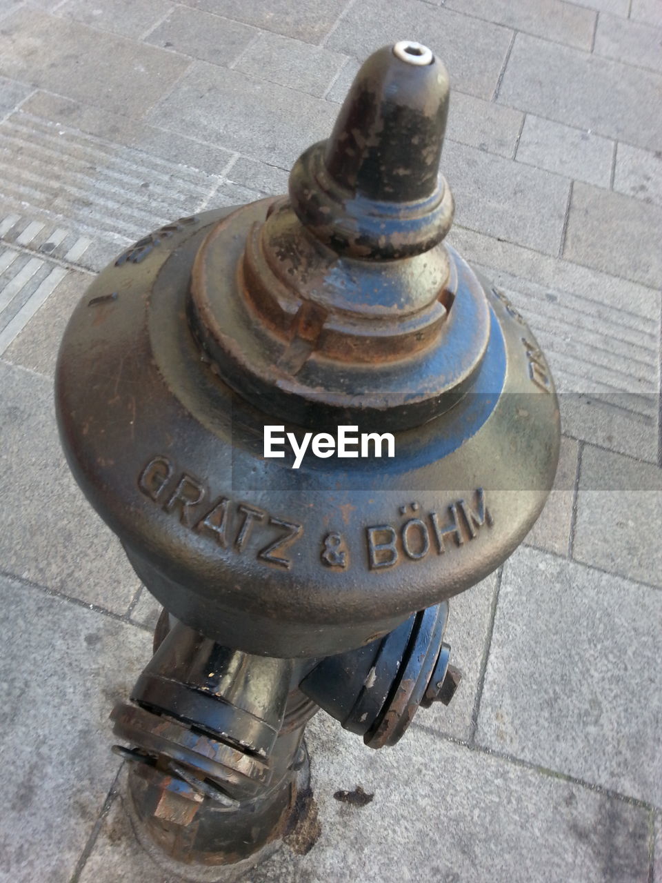 CLOSE-UP OF FIRE HYDRANT ON SIDEWALK