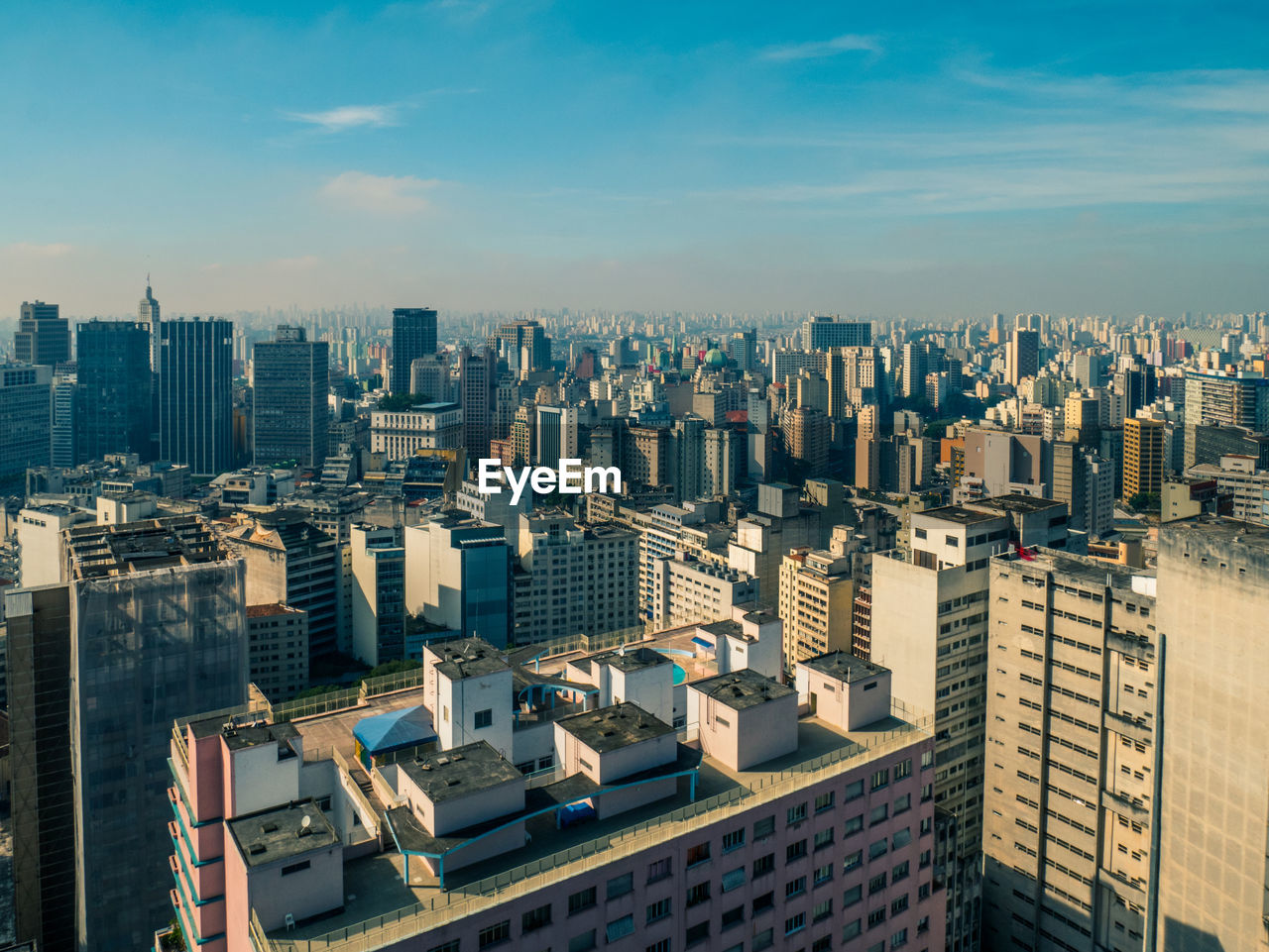 High angle view of buildings in city against sky