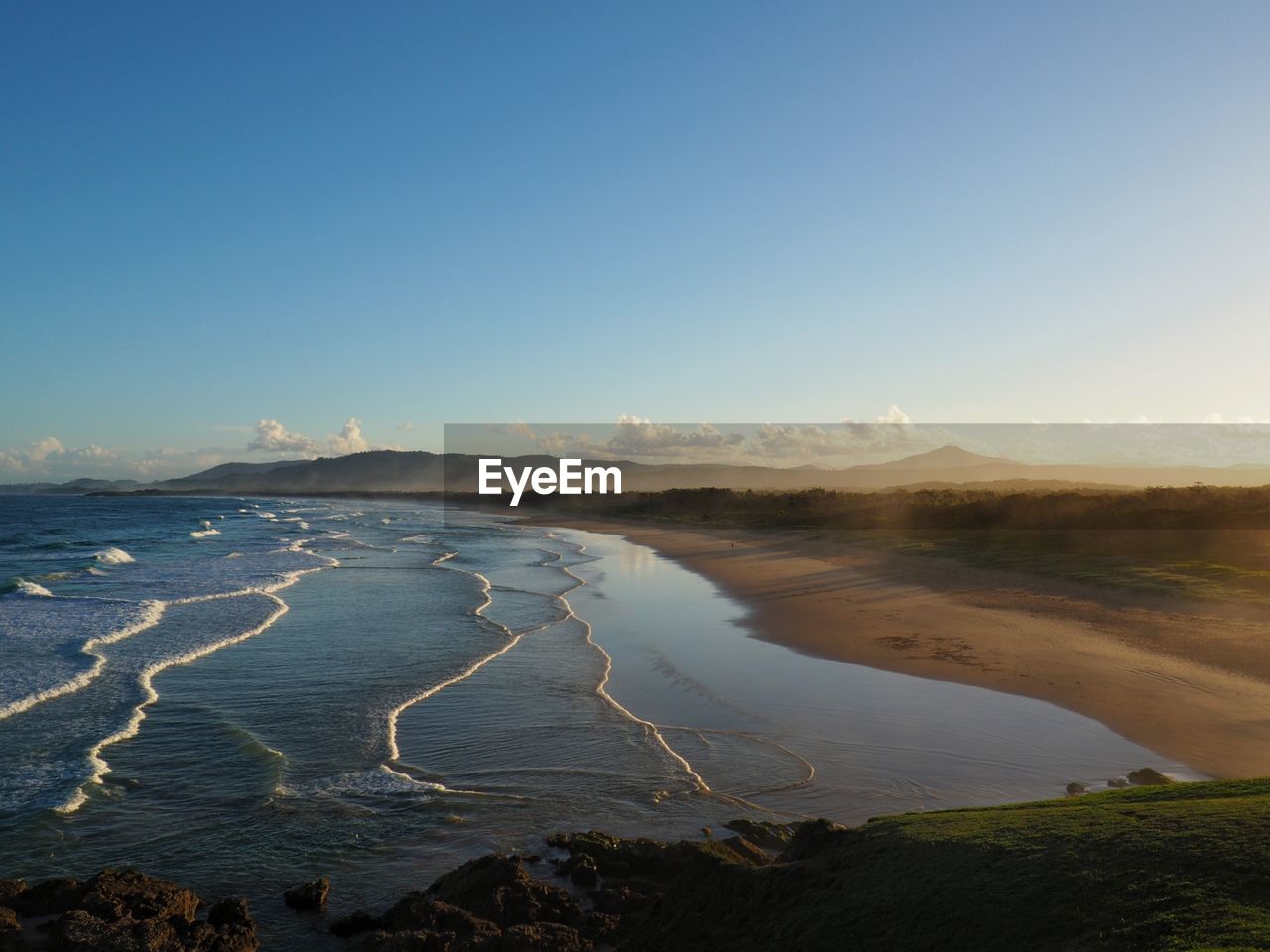 Scenic view of sea against clear blue sky