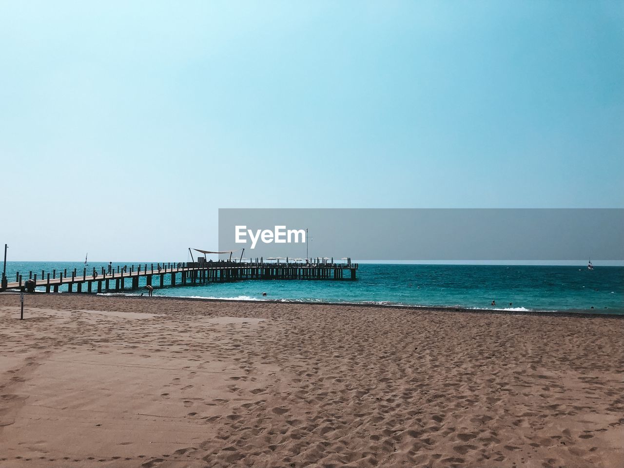 Scenic view of beach against clear sky
