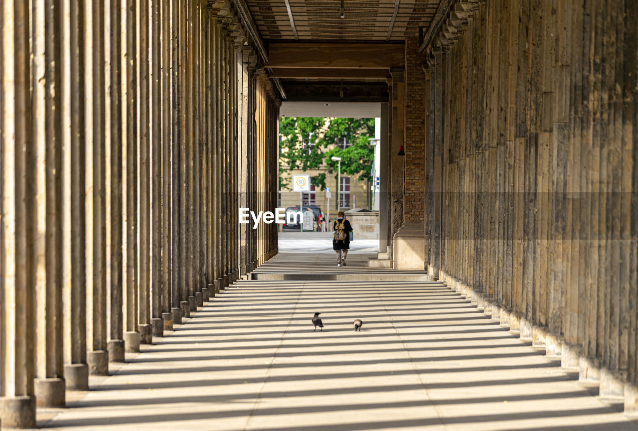 People walking on corridor of building