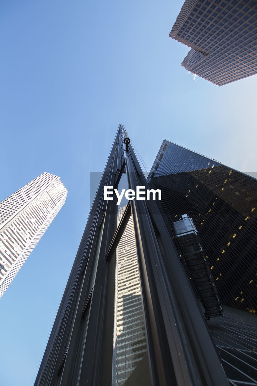 LOW ANGLE VIEW OF MODERN BUILDINGS AGAINST CLEAR SKY