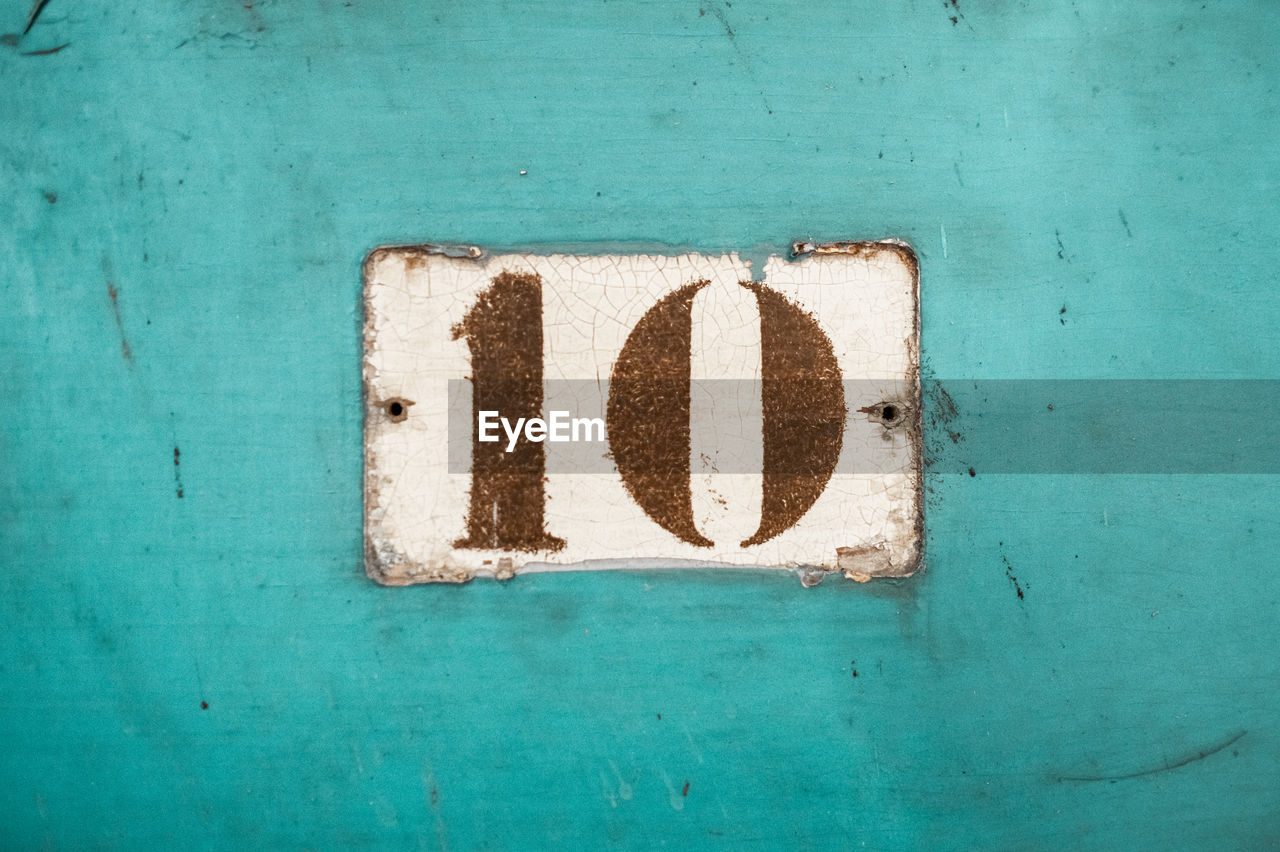 Close-up of number 10 on wall