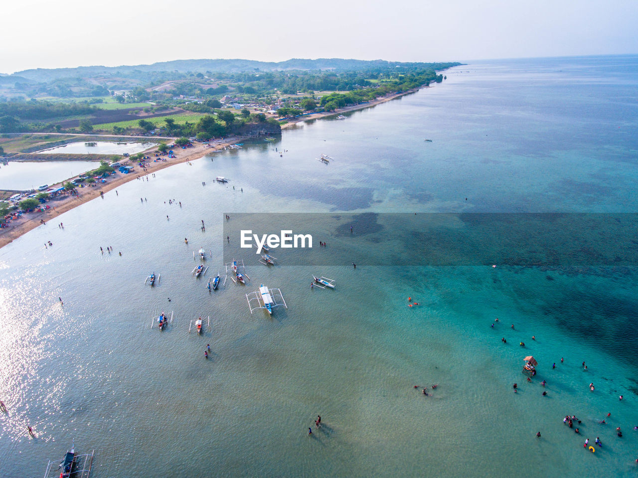 HIGH ANGLE VIEW OF PEOPLE AT BEACH