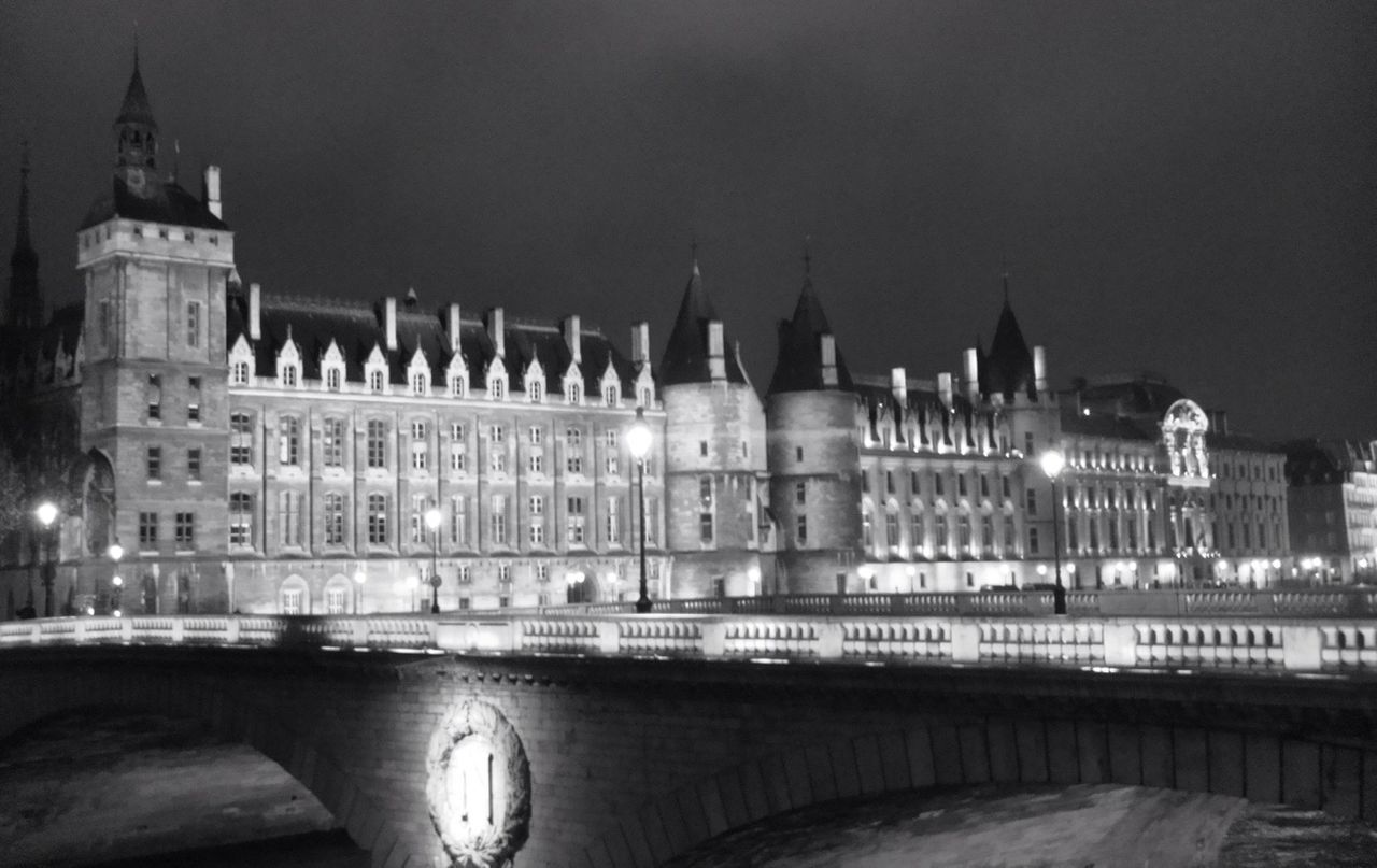 VIEW OF ILLUMINATED BUILDING AT NIGHT