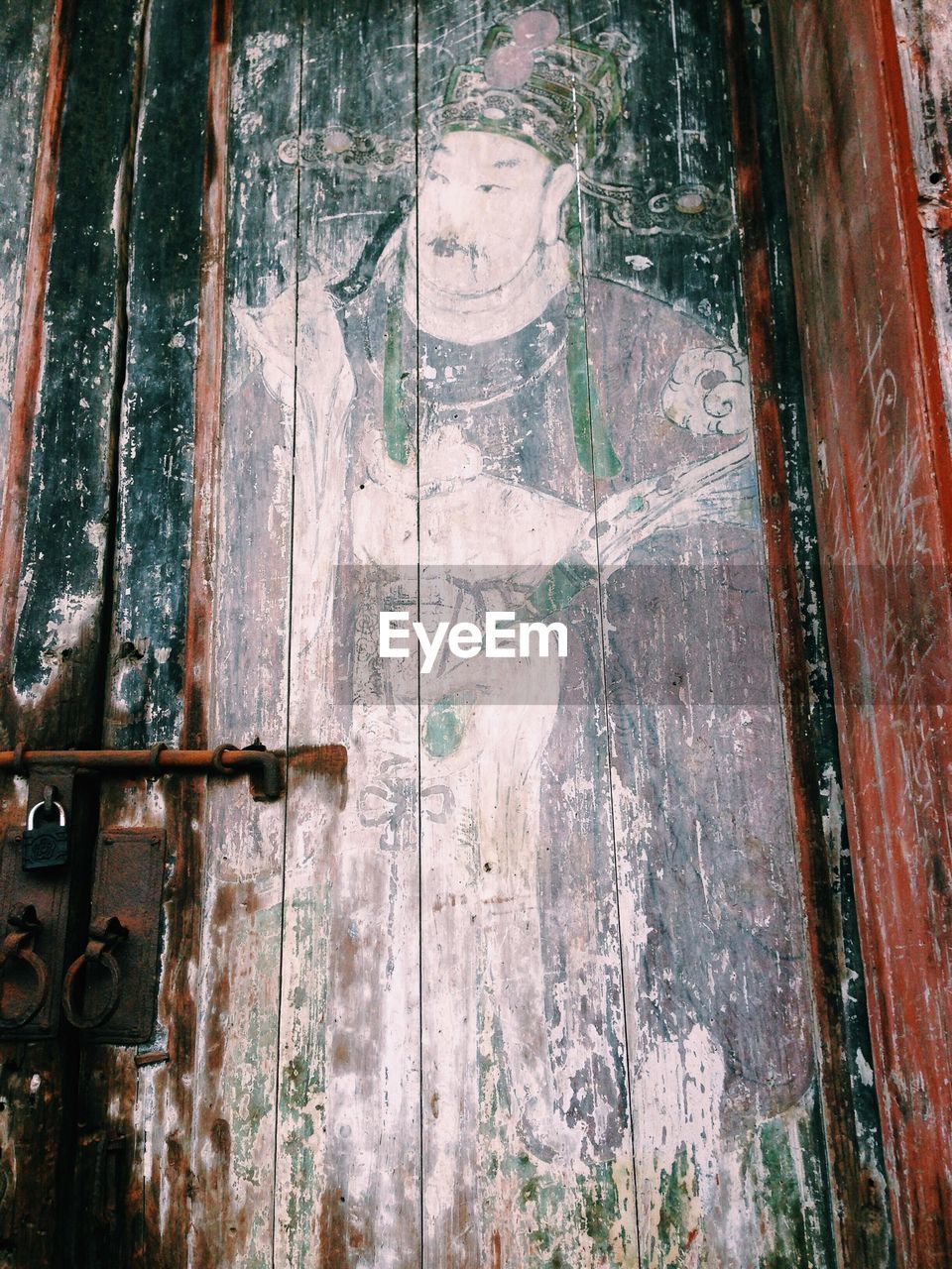 Human image design fading away on wooden door