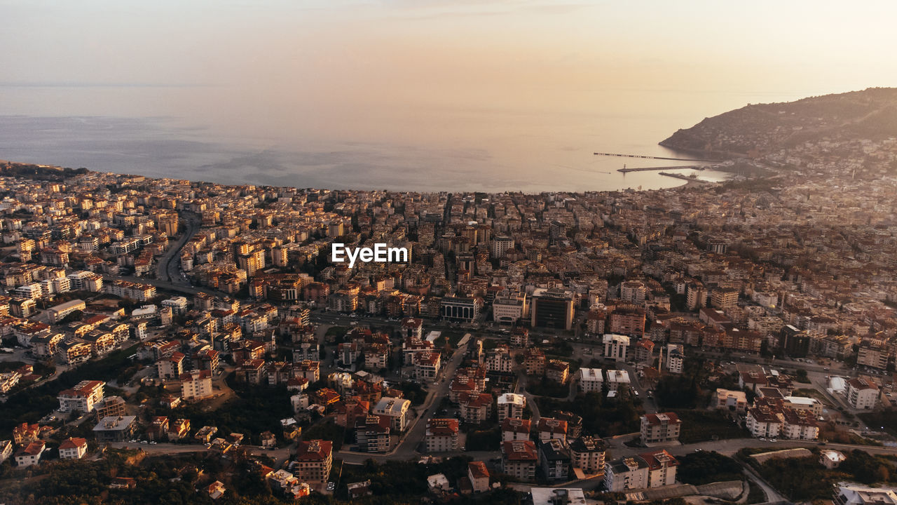 Panoramic aerial view of alanya, coastline, houses and port.