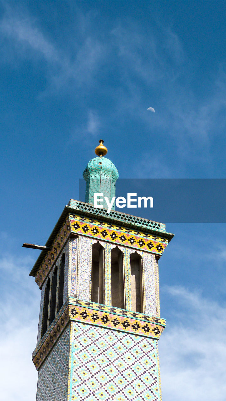 Low angle view of minaret at shah mosque