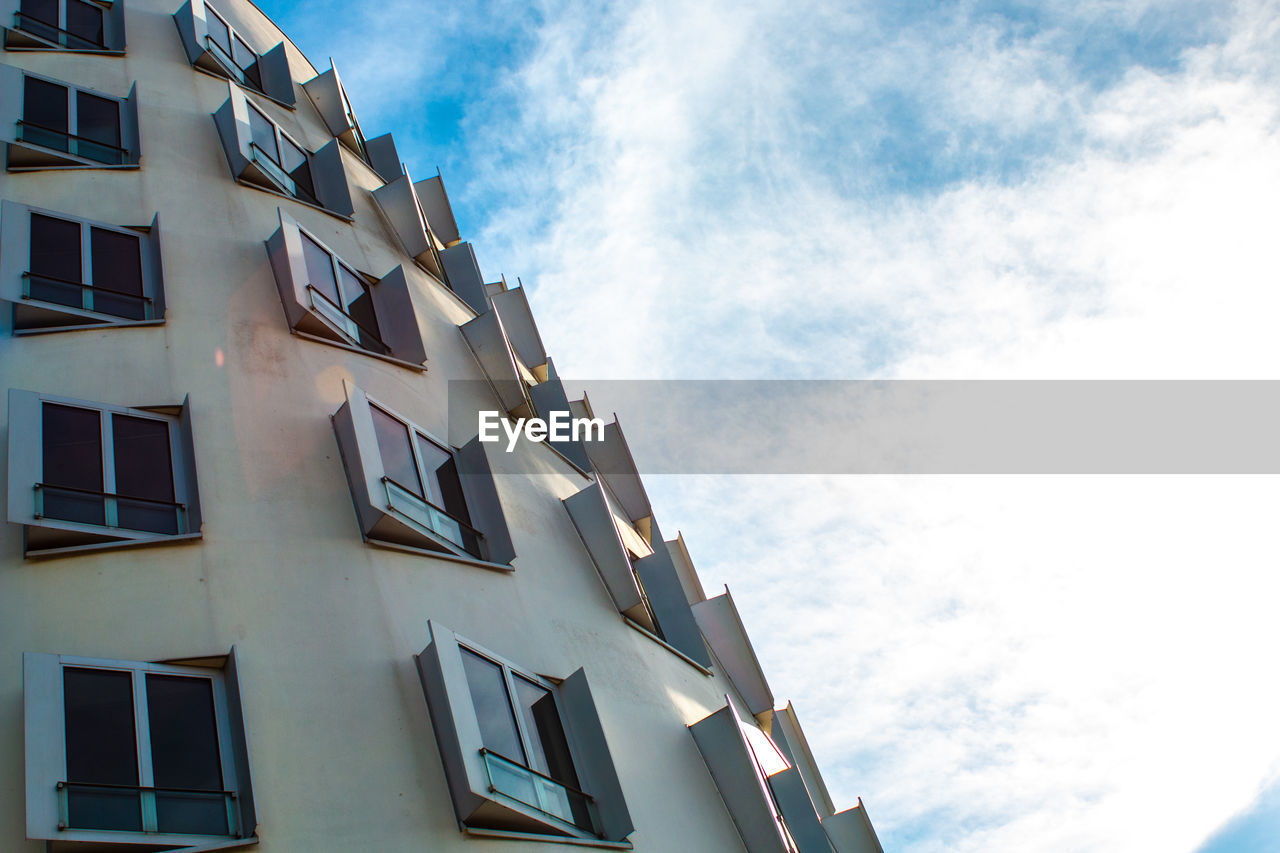 LOW ANGLE VIEW OF RESIDENTIAL BUILDINGS AGAINST SKY