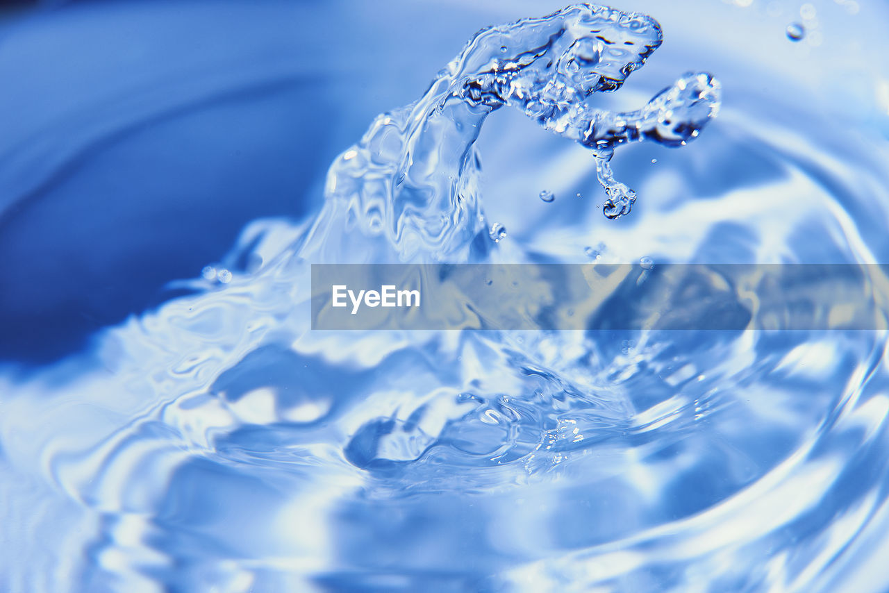 water, blue, motion, rippled, splashing, drop, nature, azure, close-up, no people, macro photography, freezing, petal, freshness, food and drink, indoors, falling, backgrounds, refreshment, purity, selective focus, studio shot, cobalt blue