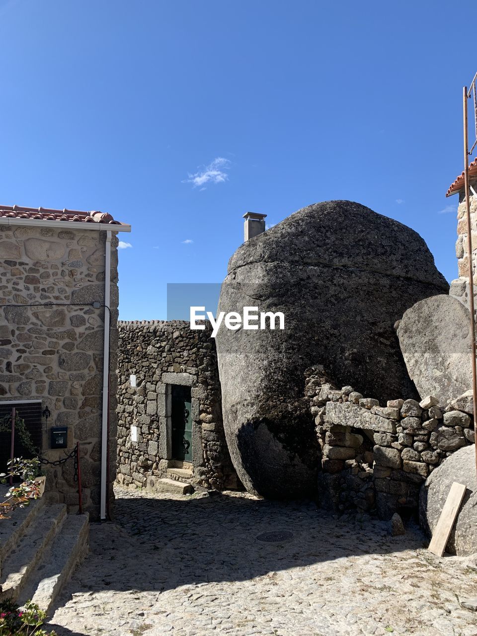 OLD BUILDINGS AGAINST BLUE SKY