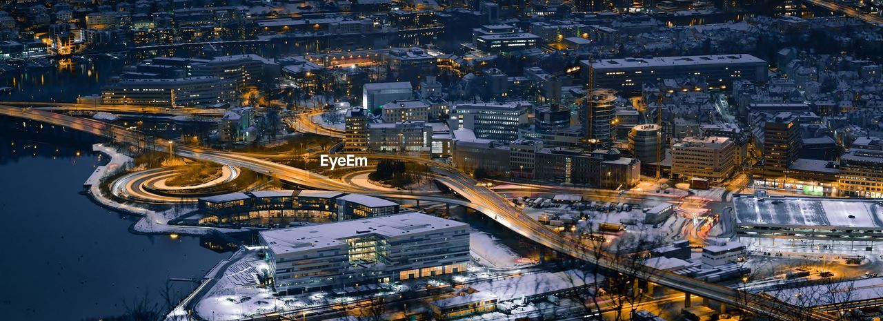 High angle view of illuminated cityscape at night