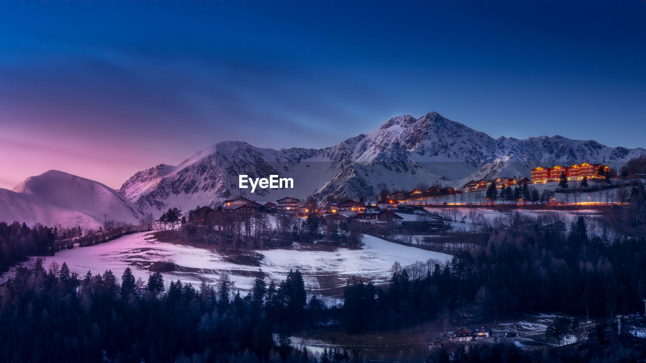 Snowcapped mountains against sky during a colorful sunset in winter near rodengo 