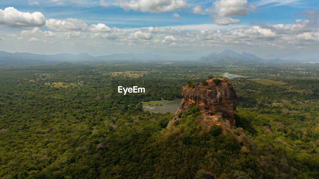 environment, landscape, mountain, sky, nature, scenics - nature, cloud, wilderness, land, travel destinations, travel, forest, mountain range, plant, beauty in nature, tree, ridge, plateau, no people, architecture, tourism, outdoors, adventure, tranquility, terrain, high angle view, non-urban scene, day, aerial photography, natural environment, tranquil scene, rock, valley, aerial view, building, rural area, history, built structure, green, rural scene, horizon