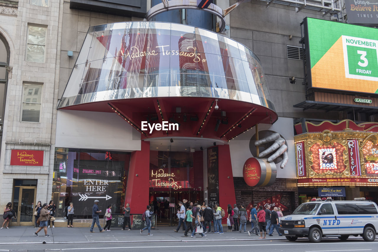 PEOPLE IN FRONT OF BUILDING