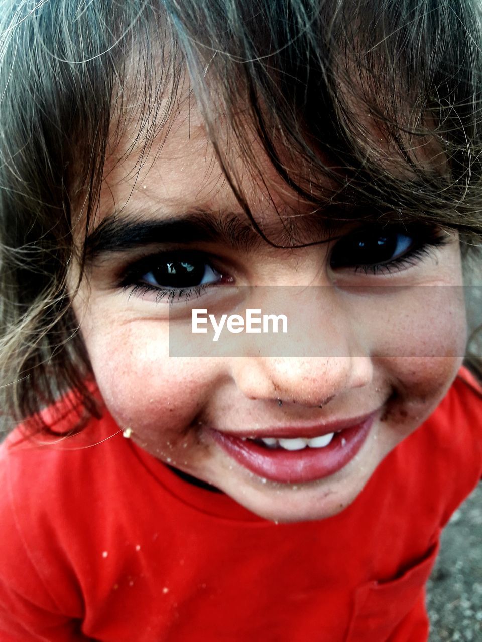 Close-up portrait of smiling girl