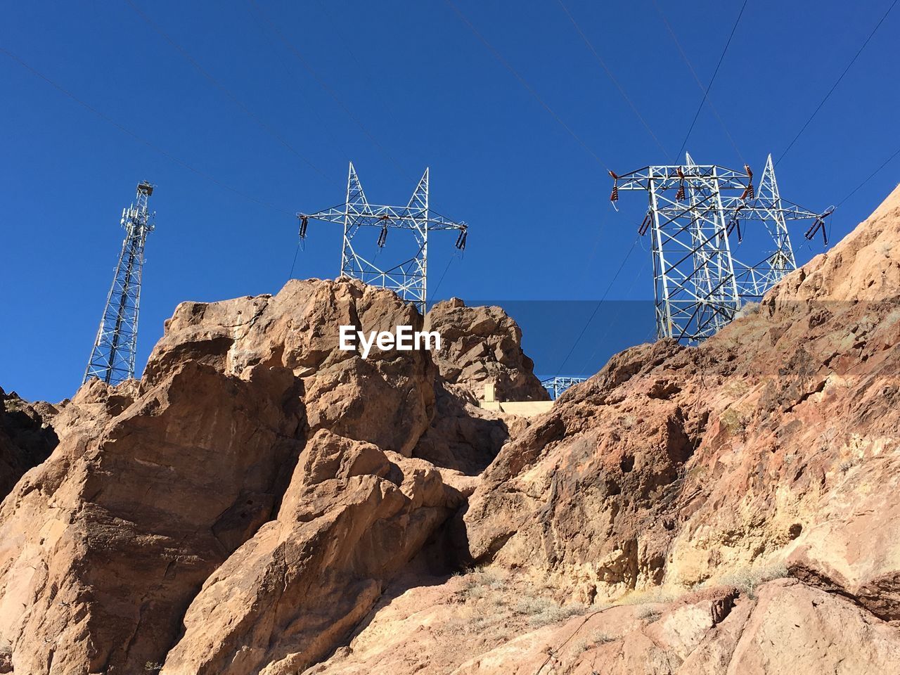 LOW ANGLE VIEW OF ELECTRICITY PYLON AGAINST SKY