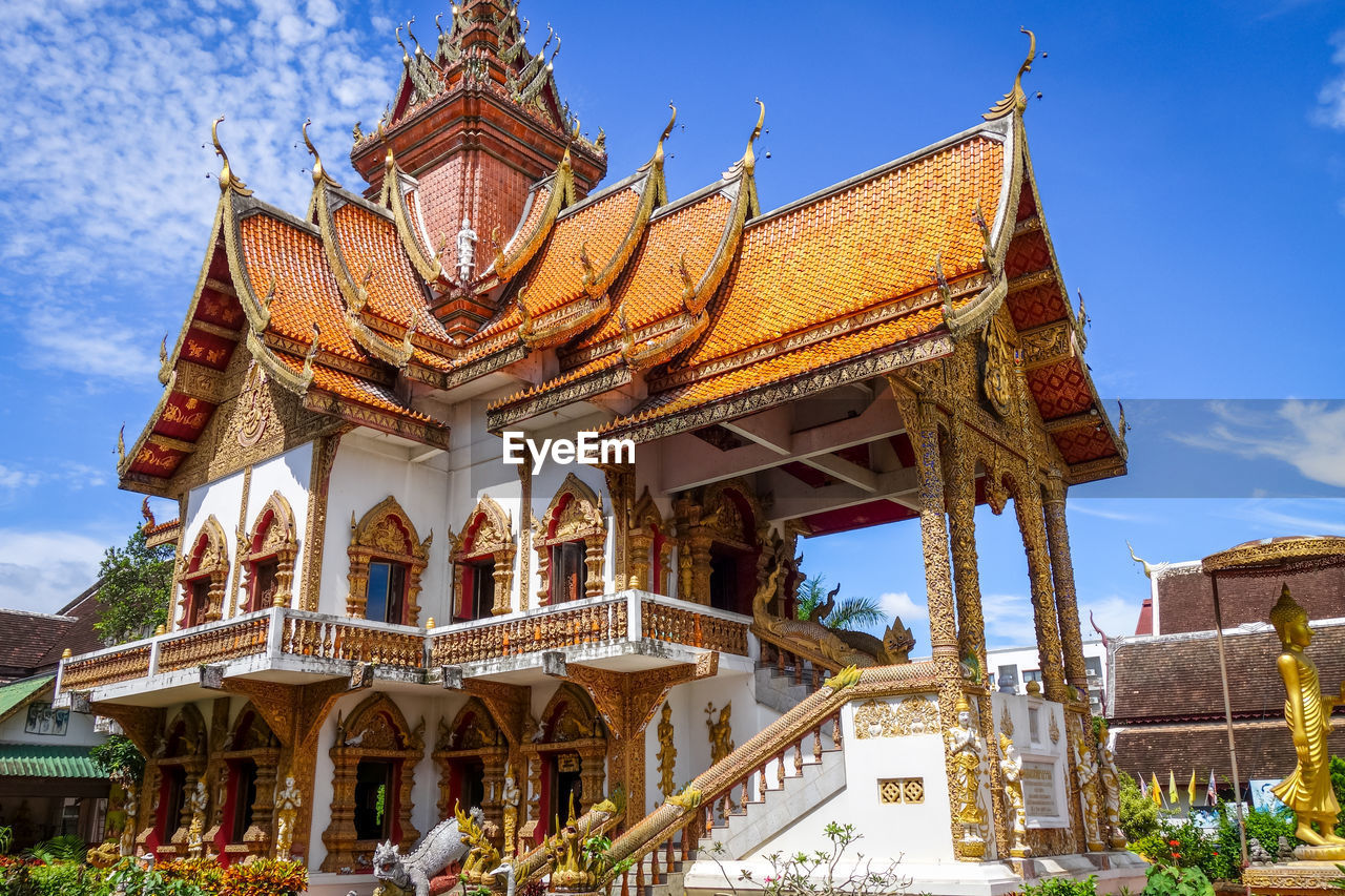 LOW ANGLE VIEW OF TEMPLE AGAINST BUILDING