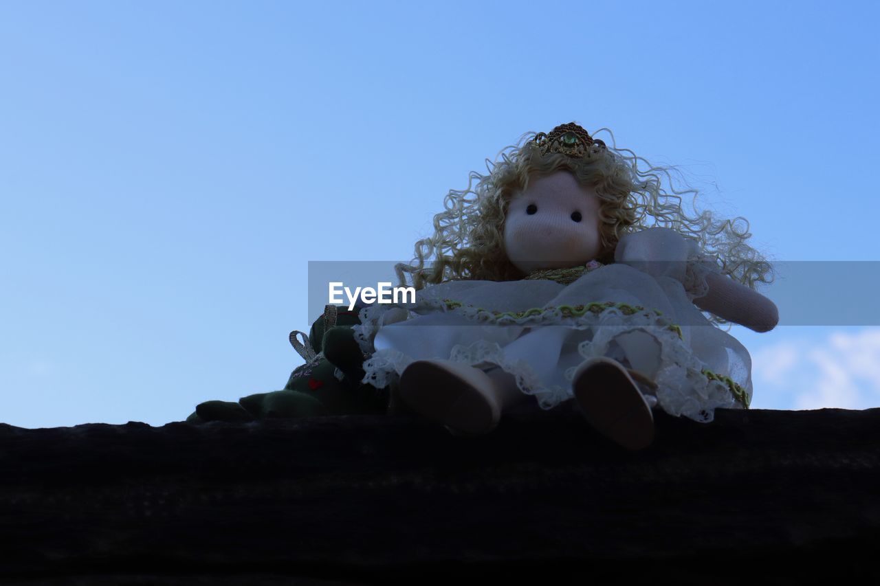 sky, blue, childhood, child, nature, toy, copy space, one person, clear sky, low angle view, representation, day, outdoors, innocence, human face