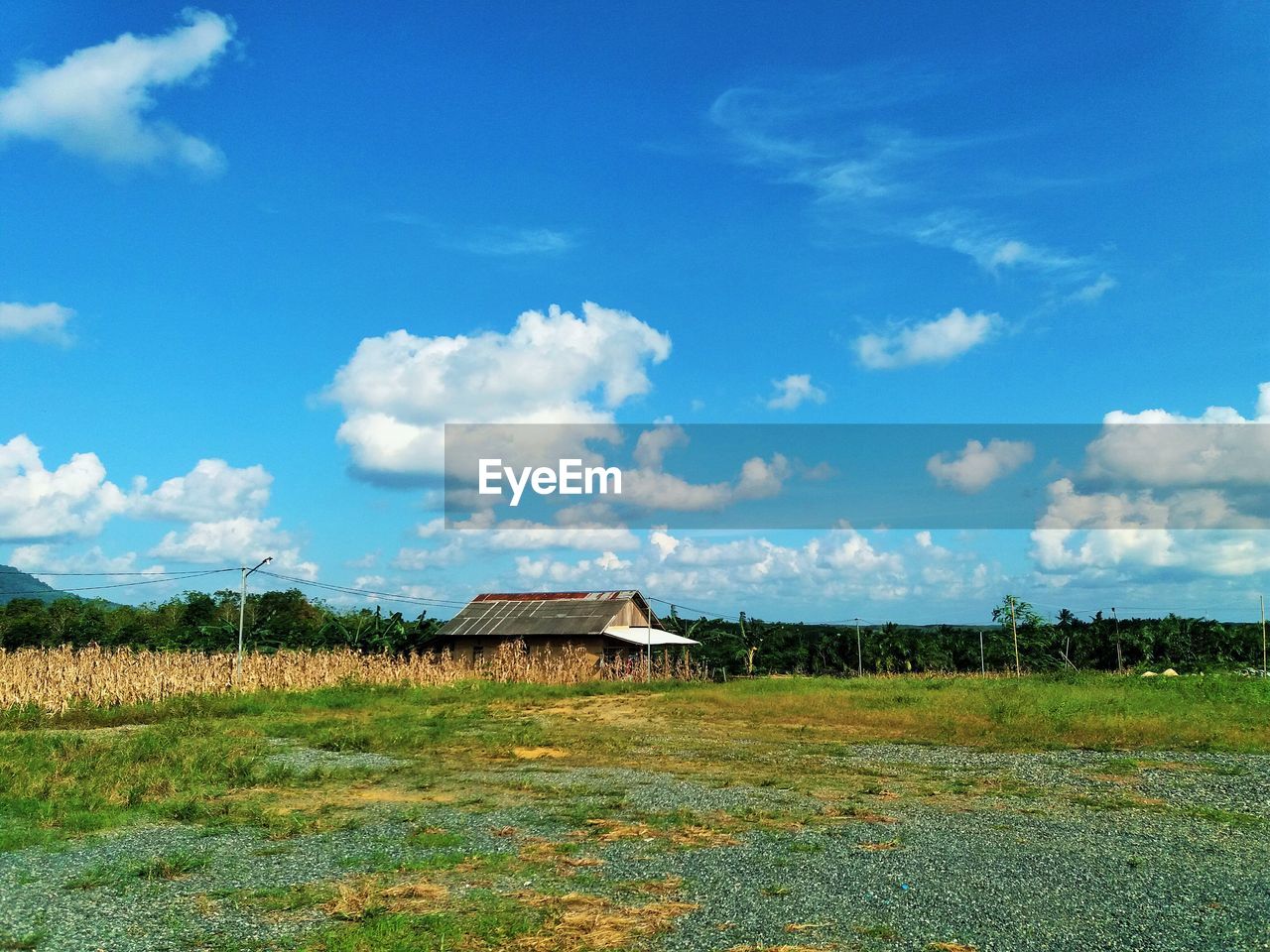 House on field against sky