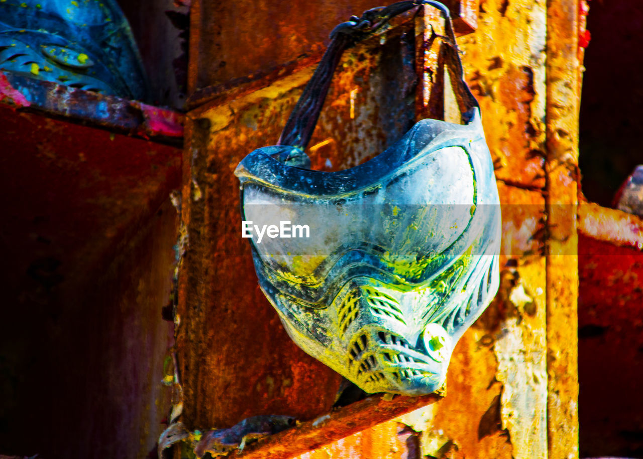 CLOSE-UP OF OLD RUSTY METAL HANGING